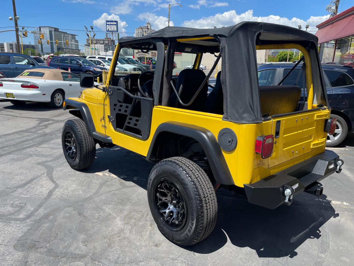 2000 Solar Yellow /Black Jeep Wrangler SE (1J4FA29P9YP) with an 2.5L 4 Cyl. engine, Manual transmission, located at 801 South State Street, Salt Lake City, UT, 84111, (801) 328-0098, 40.751953, -111.888206 - Wow extremely rare to find extra clean Jeep in immaculate condition 4x4! Low miles only 98,248 miles! Interior and exterior are both in excellent shape for the year. This is a clean title no reported accidents on the CarFax history report. It has passed emissions already and is ready to go. Featur - Photo#7